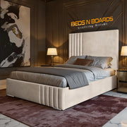 Modern bedroom with a large hamilton luxury bed, lamps, and artwork on a wall.